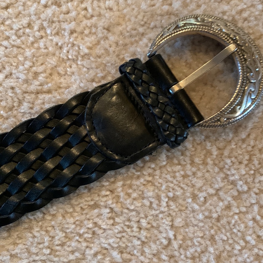 Black woven leather belt with silver buckle.